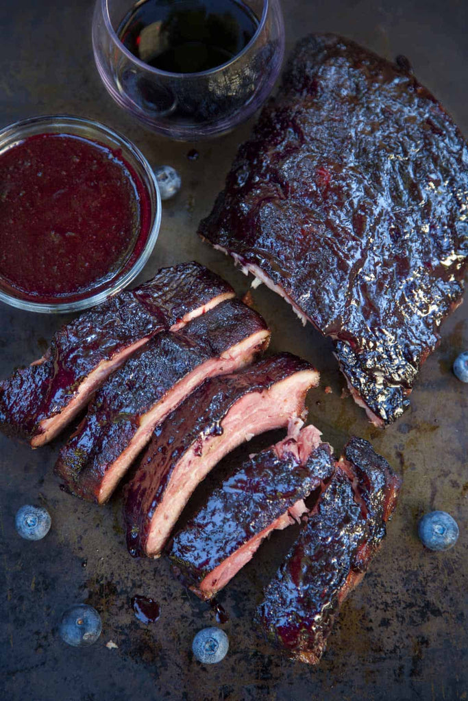 Blueberry Bourbon Smoked Baby Back Ribs have incredible rich and savory flavors. This is a fun take on a smoked baby back rib recipe to try if you want to change up from traditional BBQ flavors.